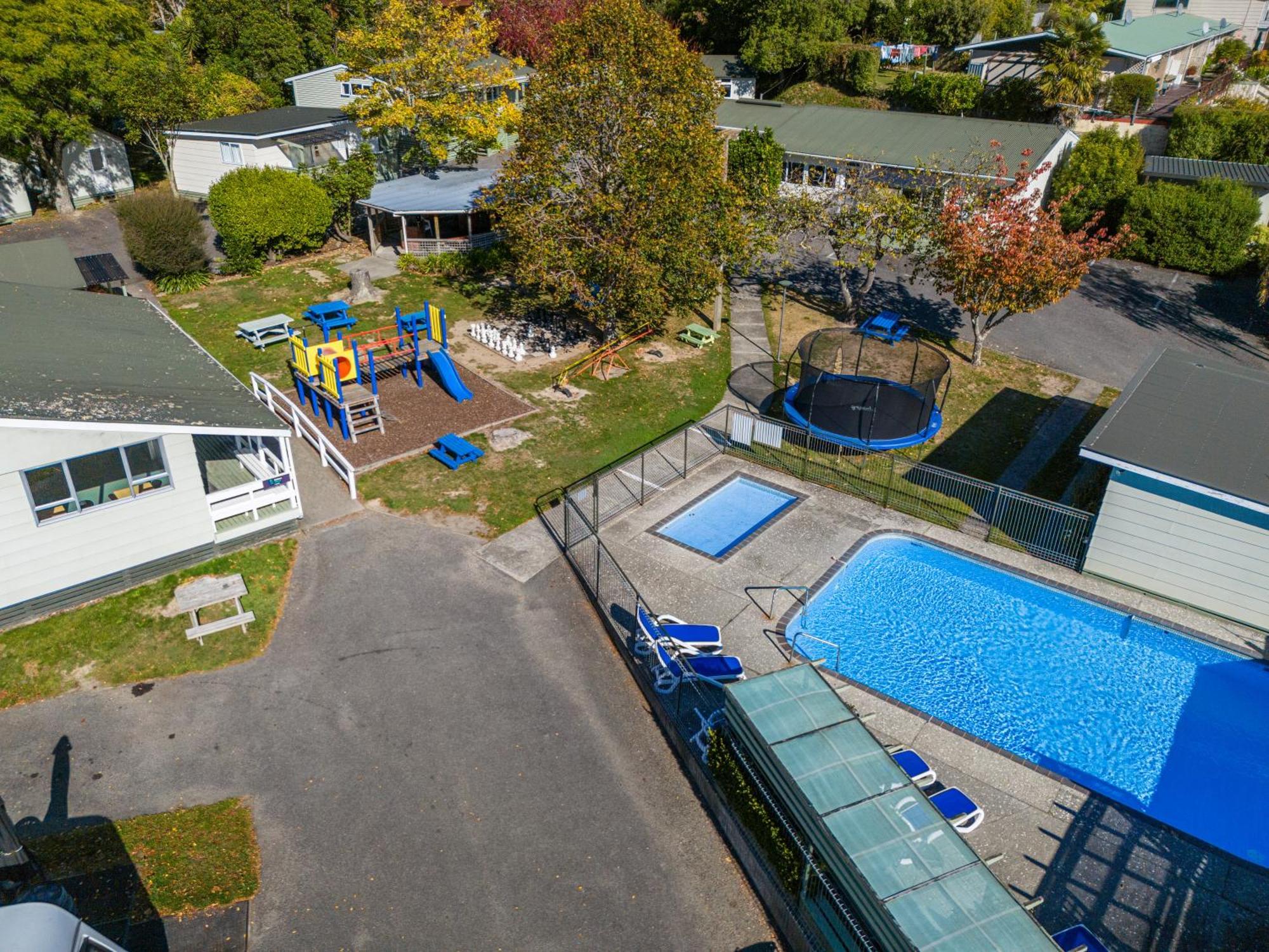 Tasman Holiday Parks Picton Exterior photo Aerial view of the school's swimming pool